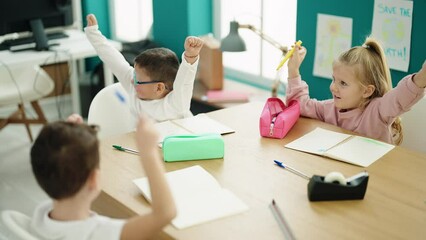 Poster - Group of kids students sitting on table with winner expression at classroom