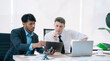 © NINENII - Group of diverse business people discussing a project in a meeting for analysis graph company financial.