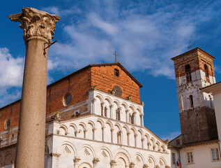 Wall Mural - Romanesque Church of Santa Maria Forisportam (St Mary) erected in 12th century in the historical center of Lucca, with ancient roman column