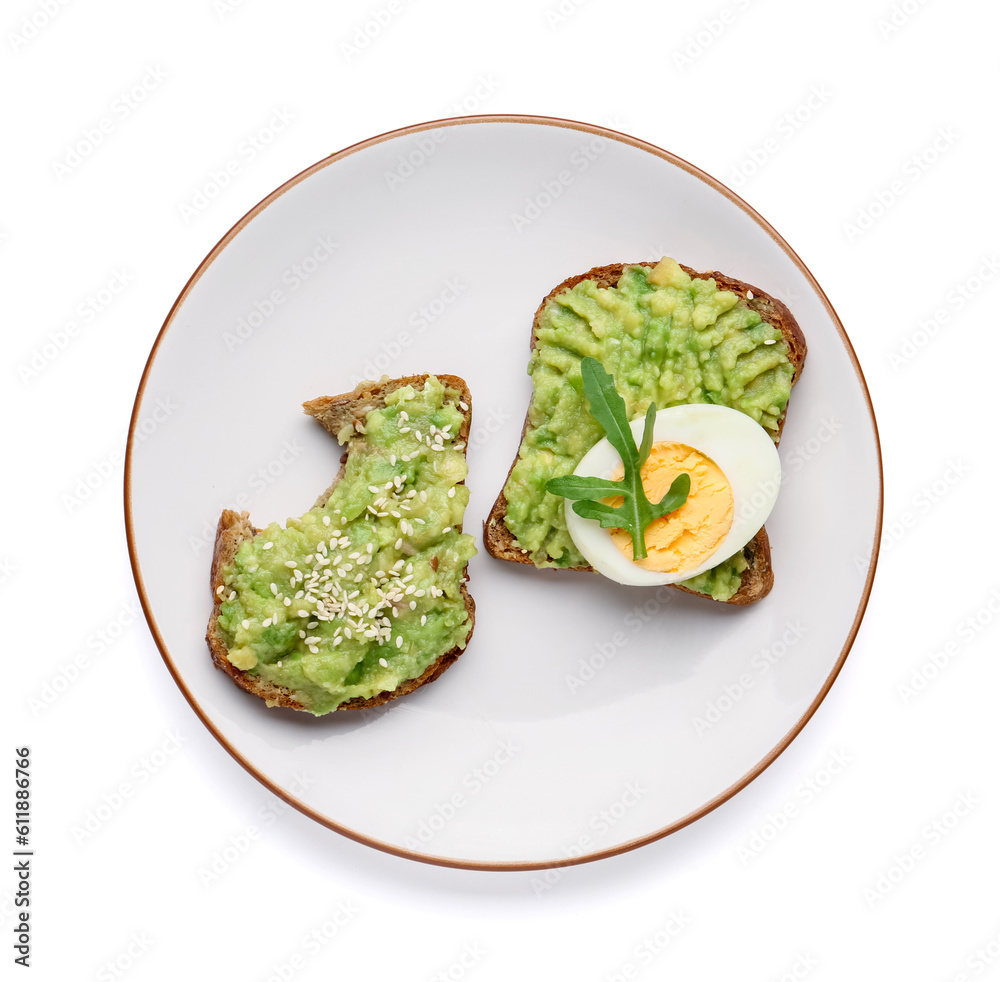 Plate of tasty avocado toasts with egg on white background