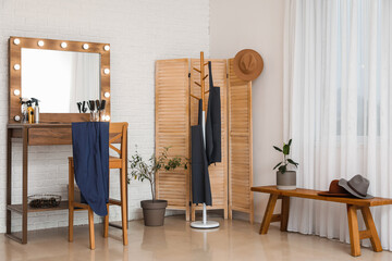 Poster - Interior of beauty salon with stylish table and folding screen