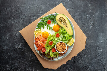 Wall Mural - Keto plate of healthy food in a pizza box. Concept of healthy eating or fast food