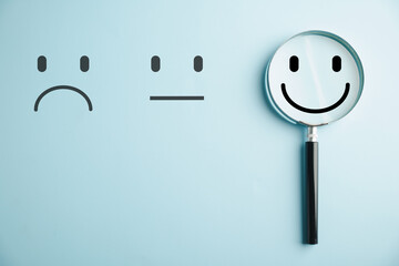Find joy smiley face icon magnified in glass among sadness. Customer satisfaction and evaluation post-service or marketing survey. Magnifying, satisfaction, reputation depicted.