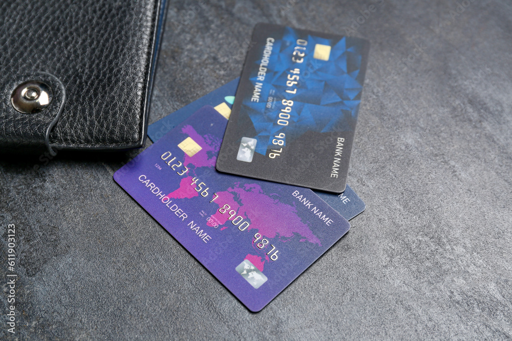 Credit cards with wallet on black grunge table