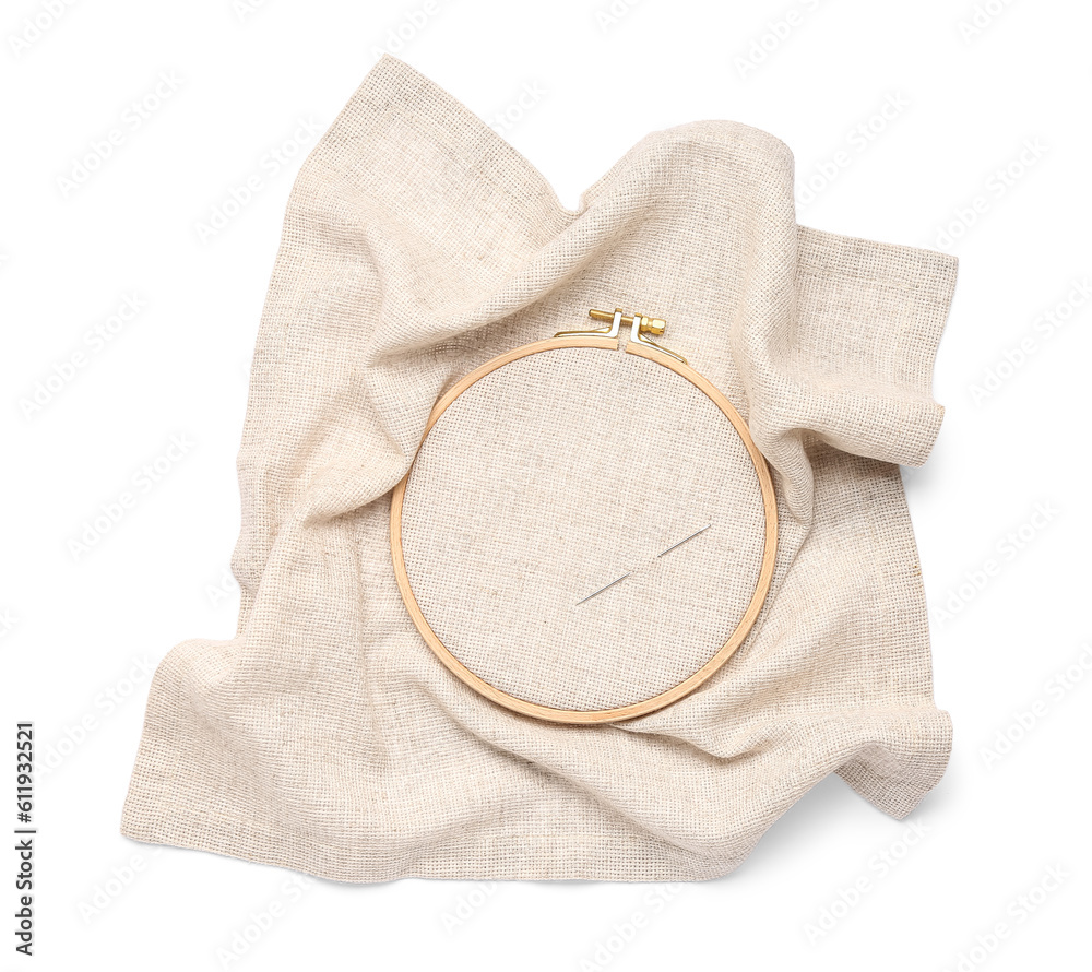Wooden embroidery hoop with needle isolated on white background