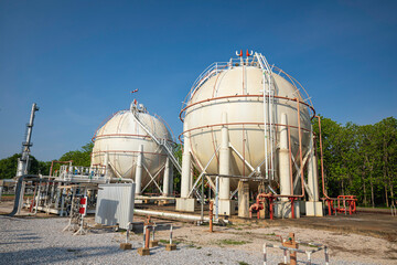 Wall Mural - White spherical propane tanks containing fuel gas