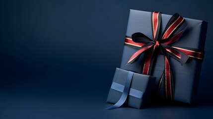 Blue gift box, notebook and neckties on dark blue background.