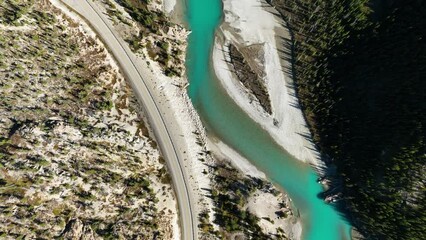 Wall Mural - a drone view of the river in the mountains valley. an aerial view of an autumn forest. winding river