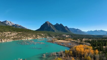 Wall Mural - a drone view of the river in the mountains valley. an aerial view of an autumn forest. winding river
