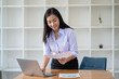 © PaeGAG - Asian woman working with laptop in her office. business financial concept.