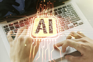 Poster - Creative artificial Intelligence symbol concept with hands typing on laptop on background. Multiexposure