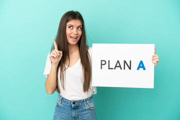 Young caucasian woman isolated on blue background holding a placard with the message PLAN A and thinking