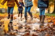 Leinwandbild Motiv Image of a child's rubber boots splashing in a puddle