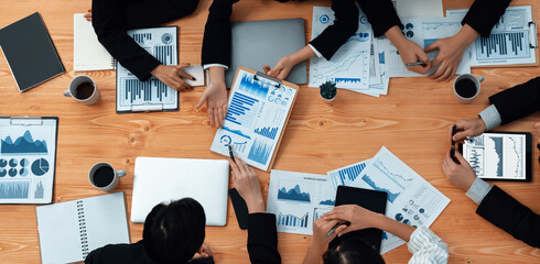 Poster - Top-view closeup business team of financial data analysis meeting with business intelligence, report paper and dashboard on laptop. Business group people working together in harmony office.