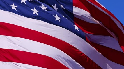 Wall Mural - close up of the us flag blowing in the breeze.