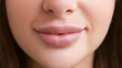 © golubovy - Lip plumping. Female beauty. Macro view portrait. Happy unrecognizable woman with nude puffy mouth pretty smiling closeup.