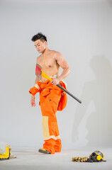 Canvas Print - Professional firefighter stands adorned with a serious expression that reflects the gravity of his duty.