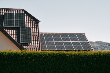  Solar panels on the roof. Concept of using photovoltaics in rural areas and countryside for a sustainable future. Modern house with an alternative source of electrical energy.