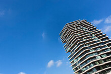 Netherlands, North Holland, Amsterdam, Modern Apartment Building Standing Against Blue Sky