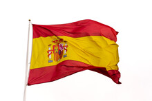 Flag Of Spain Waving In The Wind With White Background And Copy Space