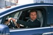 © standret - Businessman in suit is driving his electric car