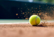 Tennis ball hits the red clay ground kicking up the dust - ai generative