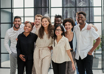 Team at work. Group of young business people in smart casual wear working together in creative office