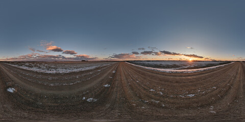 Wall Mural - winter 360 hdri panorama on gravel road with evening clouds on blue sky before sunset in equirectang