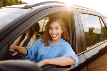 Two young women on car trip having fun. Lifestyle, travel, tourism, nature, active life.