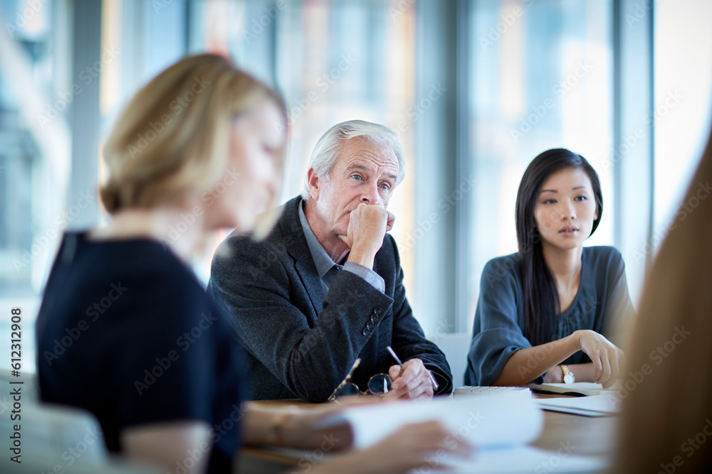 Attentive senior businessman listening in meeting Stock Photo | Adobe Stock