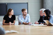 © KOTO - Business people discussing paperwork in meeting