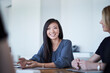 © KOTO - Smiling businesswoman in meeting