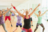 Fitness instructor leading aerobics class