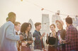 © KOTO - Young adult friends drinking and enjoying rooftop party