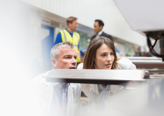 Wall Mural - Engineers inspecting piece in steel factory