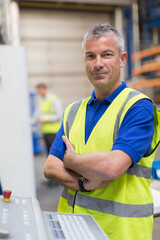 Wall Mural - Portrait confident worker at control panel in steel factory