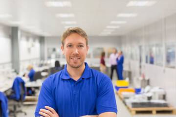 Wall Mural - Portrait smiling worker in steel factory office