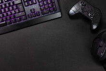 Purple Lit Keyboard By Game Controller And Mouse