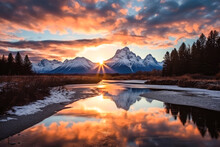 An Epic Sunrise By The Grand Teton Mountains Reflected In The River