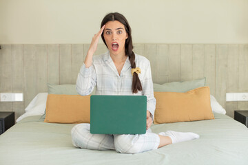 Wall Mural - pretty young model looking happy, astonished and surprised. rest and nightwear concept