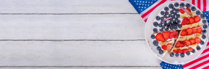 Wall Mural -  4th of July cake with flag and berries. Homemade Patriotic American flag striped vanilla cream sponge cake, Holiday Party summer dessert 
