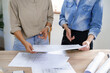 © snowing12 - Engineering construction concept, Two female engineers checking blueprint of condominium together
