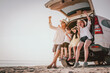 © Garun Studios - Happy family enjoying beach trip with their favorite car.