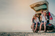 © Garun Studios - Happy family enjoying beach trip with their favorite car.