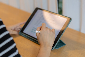 Poster - Female using digital tablet. woman working key touch display pad tablet.