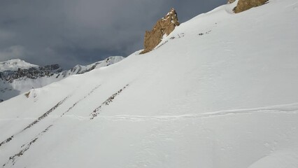 Poster - Aerial video of the rocky mountains fully covered with snow on a winter sunny day