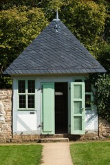 Canvas Print - Garden house surrounded by trees