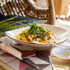 Poster - Pasta with cheese slices and herbs on white plate on the table