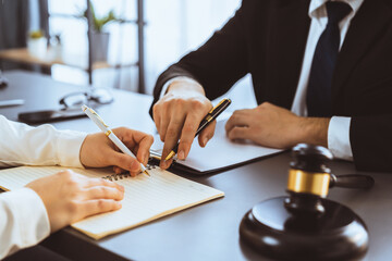 Poster - Lawyer colleagues or legal team working or drafting legal document at law firm office desk. Gavel hammer for righteous and equality judgment by lawmaker and attorney. Equilibrium