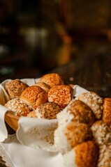 Poster - Vertical shot of wheat bread with poppy seeds and cereal wrapped in towels